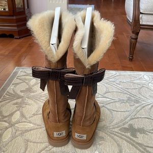 Womens tall chestnut UGG boots with dark brown leather bow